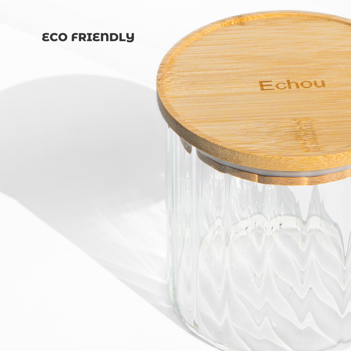 A fluted high borosilicate glass storage jar with a wooden lid, featuring a modern textured design and airtight sealing for stylish kitchen organization.