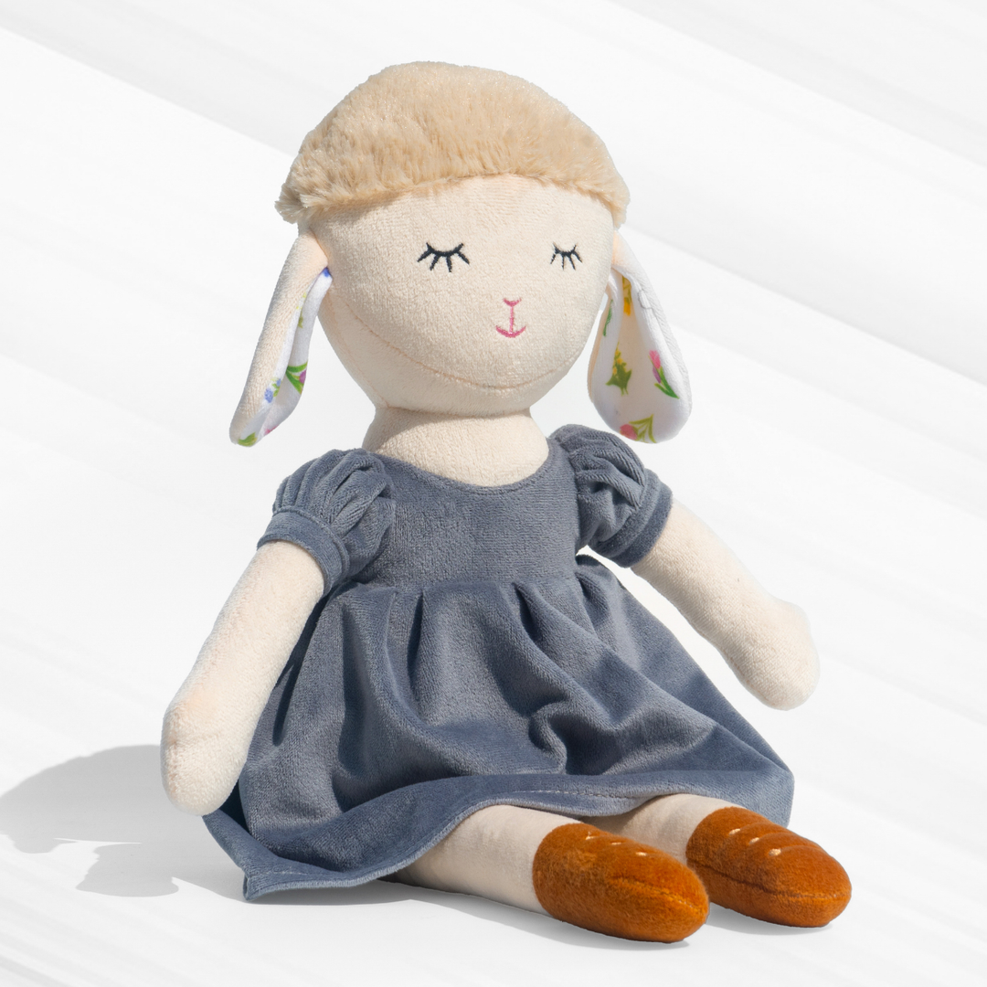 Gigi Sheep Doll in a stylish blue dress, made with plush material, super soft, huggable, and safe for kids – perfect for snuggles & decor.