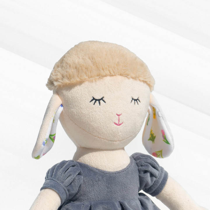 Gigi Sheep Doll in a stylish blue dress, made with plush material, super soft, huggable, and safe for kids – perfect for snuggles & decor.