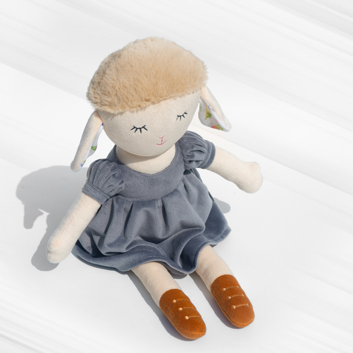 Gigi Sheep Doll in a stylish blue dress, made with plush material, super soft, huggable, and safe for kids – perfect for snuggles & decor.