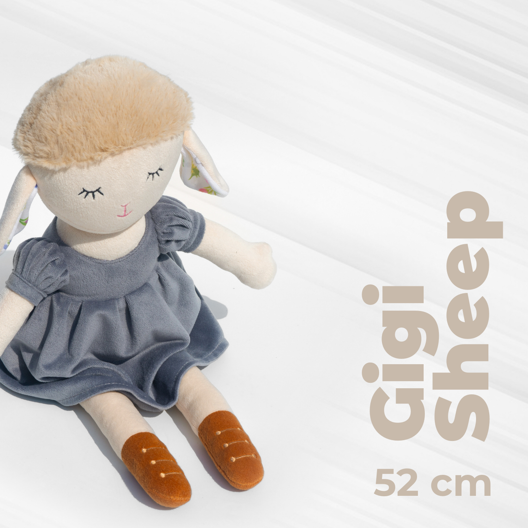 Gigi Sheep Doll in a stylish blue dress, made with plush material, super soft, huggable, and safe for kids – perfect for snuggles & decor.