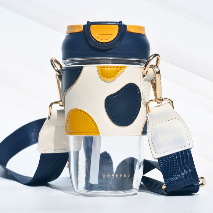 Travel Sipper with Leatherette Sleeve And a Strap