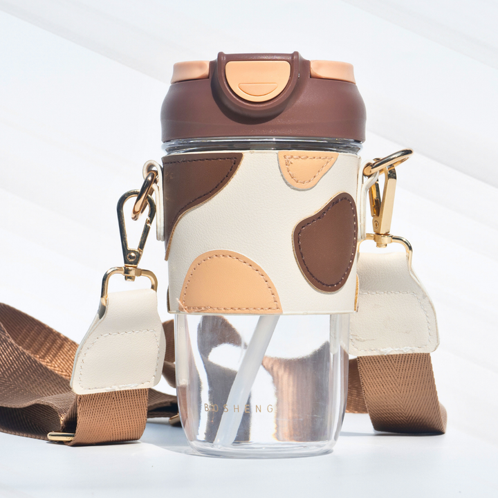 Travel Sipper with Leatherette Sleeve And a Strap